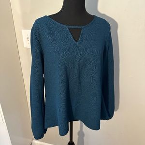 Xhiliration. Size XL green top with cut outs and neckline. Long sleeves